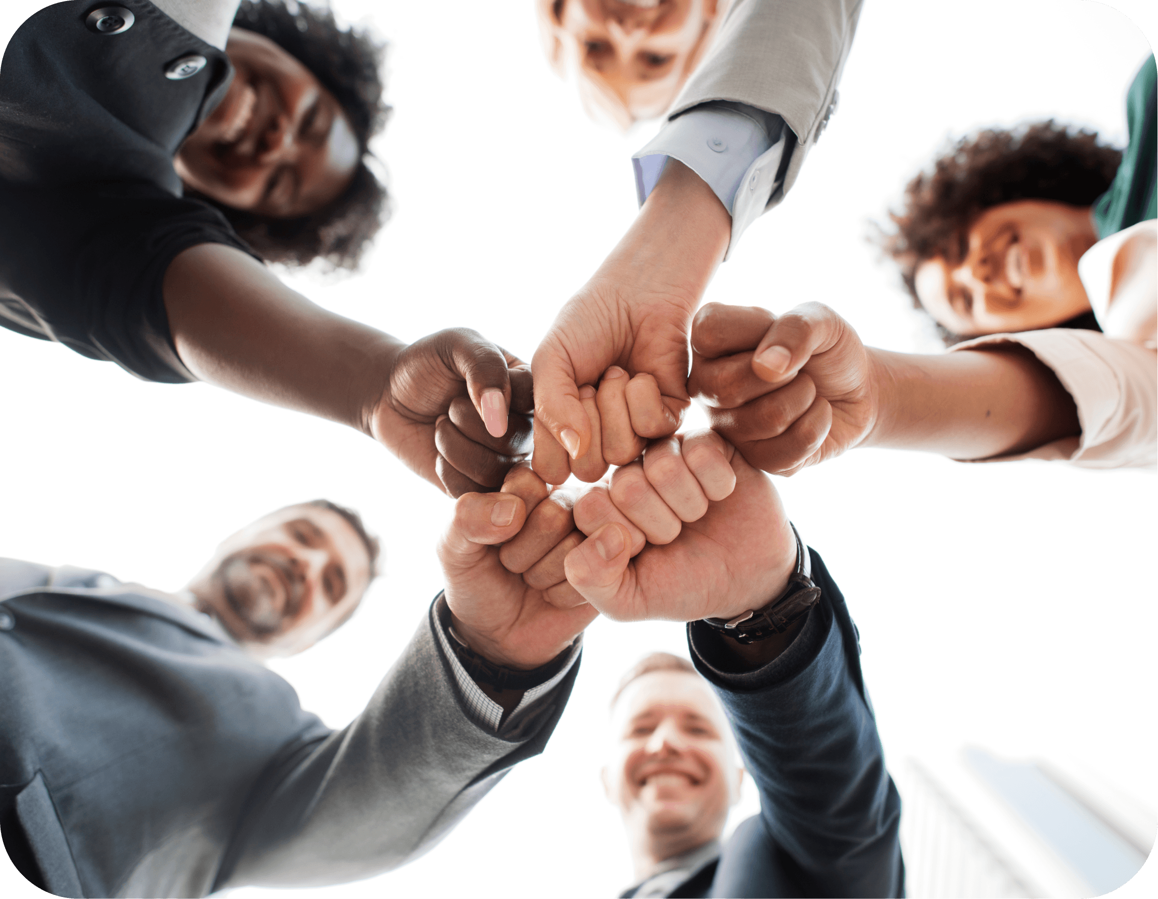 Diverse team with fists bumped together